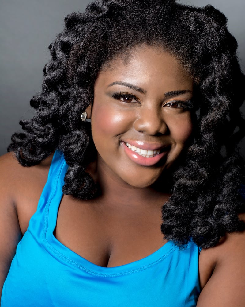 Smiling Black Female Actor Headshot With Dreads